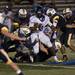 Pioneer senior running back Marquise Thomas is held back by Saline defense on Friday. Pioneer won 7-6. Daniel Brenner I AnnArbor.com